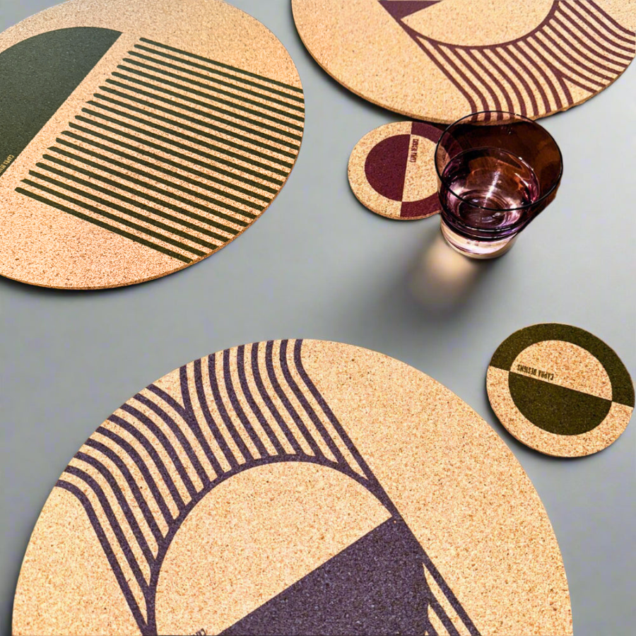 Cork coasters with geometric patterns on a gray surface